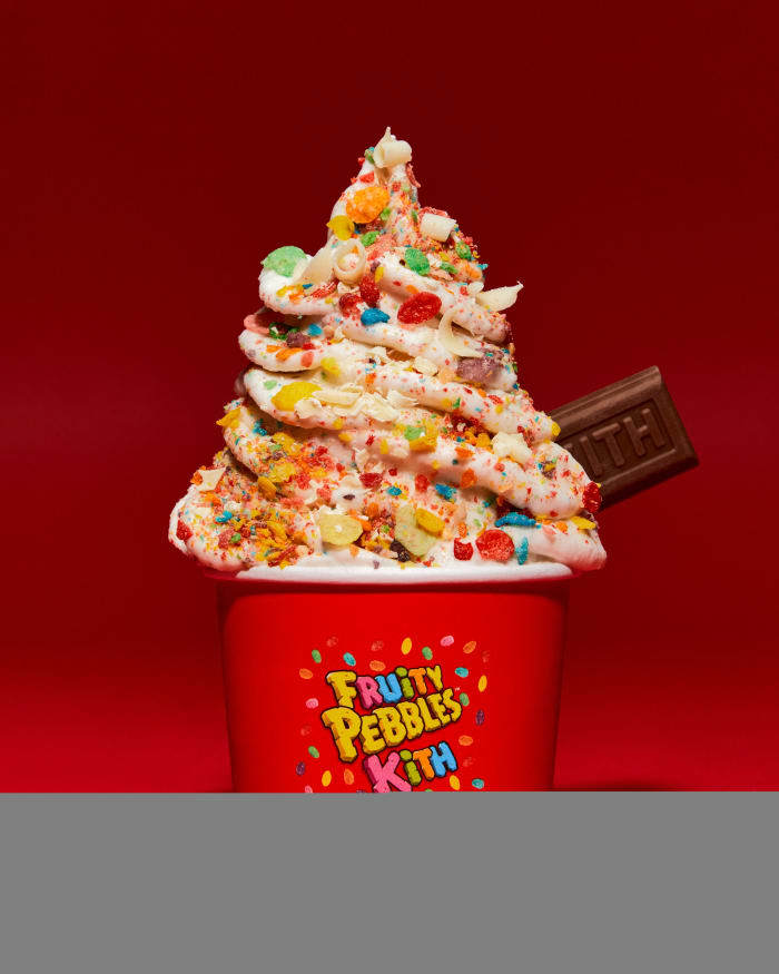 Ice cream topped with Fruity Pebbles cereal.